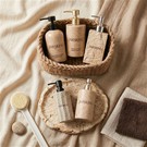 High-end Hotel Amenity Packaging (shampoo, Body Wash, And Conditioner Bottles) Made Of Stone-effect Material.