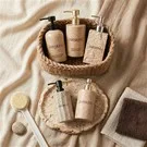High-end Hotel Amenity Packaging (shampoo, Body Wash, And Conditioner Bottles) Made Of Stone-effect Material.