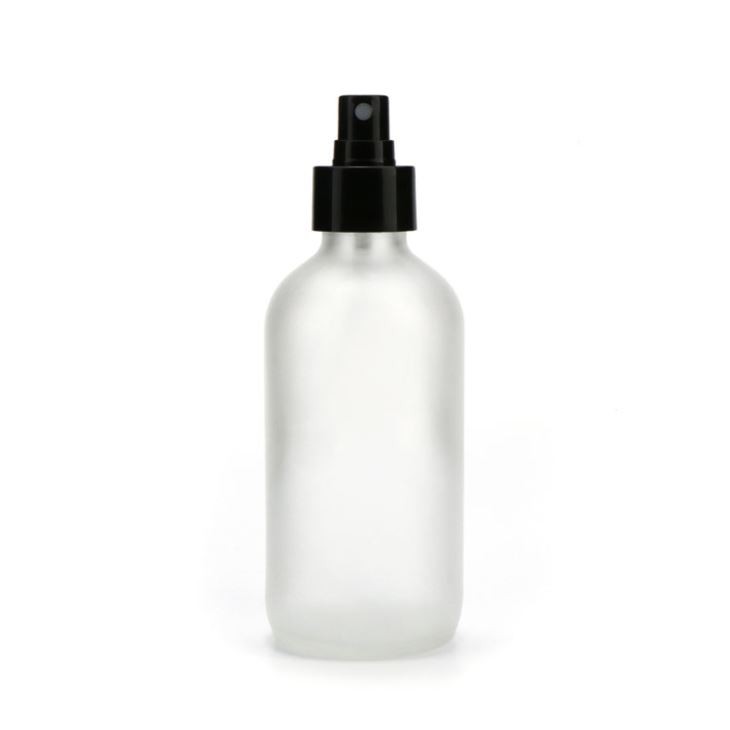 Botella de vidrio redonda Boston esmerilada transparente de 4 oz con bomba atomizadora