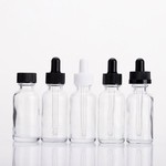 Botella de vidrio redonda Boston transparente de 2 oz 4 oz con tapa giratoria negra
