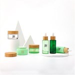 Tarro de crema de vidrio cosmético verde de 50 ml con tapa de bambú